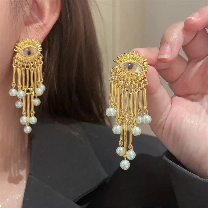 Golden Eye Tassel Earrings with Pearl Details